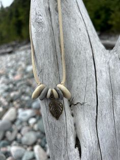 Hand drilled cairn lake superior stones with antique bronze charm -- 22" suede cord -- lobster clasp closure Bohemian Adjustable Necklace For Outdoor, Bohemian Adjustable Necklaces For Outdoor, Doll Jewelry, Suede Cord, Lake Superior, Boho Necklace, Antique Bronze, Lobster Clasp, Doll Toys