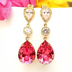 "Beautiful, romantic and sparkling Swarovski Crystal Teardrop Pink Earrings. The intricately detailed cool, crisp silver perfectly compliments the vibrant Rose Pink. I made these gorgeous Earrings with: - 18x13mm genuine Rose Pink Swarovski teardrop pear shaped fancy stones, set in sterling silver plated settings - Hypoallergenic and Tarnish resistant .925 Sterling Silver ear posts with AAA cubic zirconia stones - sparkling cubic zirconia connectors - these are approx 1 3/4\" top of the ear wire Pink Pear-shaped Earrings For Anniversary, Pink Teardrop Bridal Earrings For Party, Pink Teardrop Wedding Earrings, Pink Teardrop Earrings For Wedding, Elegant Pink Teardrop Earrings For Party, Pink Pear-shaped Earrings For Gift, Red Pear-shaped Wedding Earrings, Pink Teardrop Bridal Earrings As Gift, Pink Teardrop Dangle Earrings For Wedding