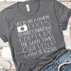 a shirt that says life is like a camera on what's important capture the good times