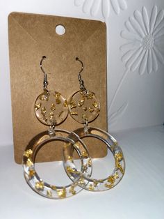 Hand-made Gold leaf resin hoop earrings  Single/ double hoop dangly earring Variety of colours and styles available  Personalised requests optional Please see other listings for colour variety Trendy Pierced Resin Jewelry, Trendy Round Resin Jewelry, Trendy Clear Resin Jewelry, Gold Resin Earrings, Trendy Resin Jewelry With Matching Earrings, Handmade Small Hoop Earrings In Clear, Resin Small Hoop Earrings For Gift, Small Hoop Resin Earrings For Gifts, Loop Resin Earrings