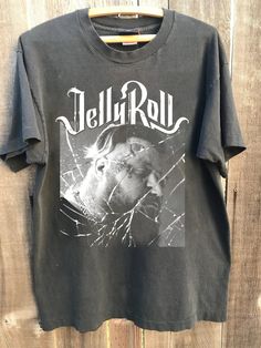 Jelly Roll Vintage Graphic Shirt, Jelly Roll Somebody Save Me T-shirt, Jelly Roll 2024 Tour Shirt, Jelly Roll Western Country Shirt NOTE ABOUT SHIPPING & CUSTOMS I use local printers in United States, Canada, UK, Australia. Germany & Italy. This ensures that you will never be charged with surprise customs fees on your tee. . All t-shirts are custom made to order and are printed using the latest ink to garment technology, a technology superior to heat transfer or screen print. - Heather colors ar Jelly Roll Concert Outfit Ideas, Vintage Graphic Shirt, Germany And Italy, Country Shirts, Concert Tshirts, Jelly Roll, Vintage Graphic, Tour Shirt, Graphic Shirt