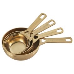 gold measuring cups and spoons on a white background