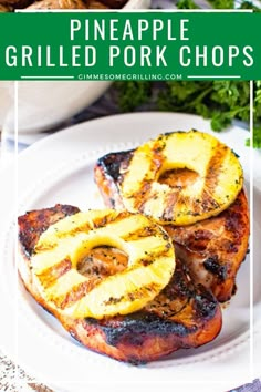 pineapple grilled pork chops on a white plate with parsley in the background