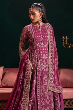 Royal Embroidered Pakistani Wedding Dress Plum Shade Lehenga Shirt is heavily jeweled with sequin work & multi-head embroidered motifs. It comes with net dupatta comprising of heavy motif spread. Detailed Description: SKU: WB417 Detailing: Embroidery, Motifs, Naqshi, Sequins, Tilla Color: Plum Fabric: Net, Tissue, Cotton Silk Design: Fully Embellished Dress with Embroidery, Goldwork Event: Party wear, Wedding Semi-stitched Kundan Gown With Intricate Embroidery, Traditional Chinon Gown With Intricate Embroidery, Eid Gown With Intricate Embroidery And Kundan, Intricately Embroidered Salwar Kameez For Reception And Festivals, Intricate Embroidered Salwar Kameez For Reception And Festivals, Embroidered Kundan Gown With Traditional Drape, Unstitched Gown With Intricate Embroidery In Traditional Drape, Traditional Embellished Gown For Eid, Embellished Traditional Gown For Eid