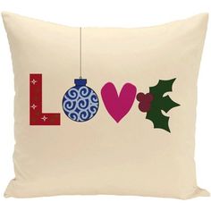 a white pillow with the word love hanging from it's side and two christmas ornaments