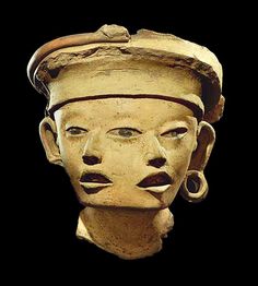 the head of an ancient statue is shown