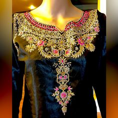 A Beautiful Black Pakistani Formal, Fancy 3 Piece Suit With Embroidered Shalwar And Finished Edges Duppatta. Satin Silk Fabric With Lining Underneath, Quality Work With Thread,Motives And Sequins.New Without Tag. Unstitched Suit With Gold Embroidery For Festivals, Designer Semi-stitched Suit With Gold Embroidery, Unstitched Suit With Gold Embroidery For Designer Wear, Anarkali Unstitched Suit With Gold Embroidery For Designer Wear, Anarkali Dress With Gold Embroidery For Diwali, Gold Embroidered Saree Dress For Party, Diwali Anarkali Dress With Gold Embroidery, Party Dress With Gold Embroidery In Saree Style, Elegant Embellished Black Sharara