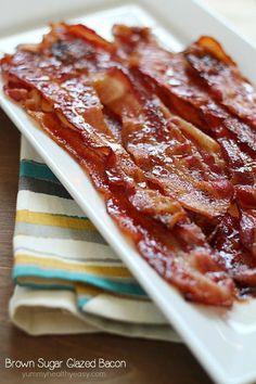 bacon on a plate sitting on top of a table