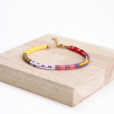 This handwoven multi-color beaded bracelet is a vibrant accessory that adds a pop of color to any outfit. Crafted with meticulous care, it features a colorful box chain design, making it perfect for summer vibes. Each bead is delicately strung together to create a unique and eye-catching pattern, making this bracelet a stylish addition to your jewelry collection. Perfect for adding a playful touch to your look, this seed bead bracelet is sure to become a staple accessory for any fashion-forward Jewelry For Teens, Colorful Box, Bracelet Summer, Color Bracelet, Fun Bracelet, Seed Bead Bracelet, Chain Design, Colorful Jewelry, Seed Bead Bracelets