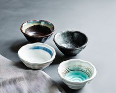 three small bowls sitting on top of a table