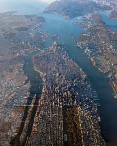 an aerial view of a city and water