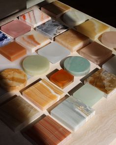 many different types of soaps on a table