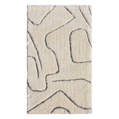 a white rug with an abstract design on the bottom and black lines in the middle