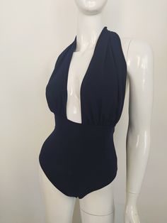 "FREE SHIPPING TO USA FOR ALL ORDERS OVER 35$! Choose right size by following our size chart below, thank you! We use FEDEX PRIORITY shipping service to the United States to guarantee the fastest delivery in 3-4 days. Flattering one piece swimsuit in dark blue fabric with open back and high cut. It has a deep neckline secured at the back of the neck with a halter tie. Stretchy and body fitting material. COLOR: DARK BLUE MEASUREMENTS: X-Small - Bust - 32\" - 34\" (82-86 CM) - Hips - 35\" - 36\" ( Fitted Backless Bodysuit For Beach Season, Fitted Backless Bodysuit For Beachwear, Fitted Backless Beachwear Bodysuit, Summer Backless Bodysuit With Lined Body, Fitted Backless Bodysuit For Pool, Summer Halter Neck Bodysuit For Pool, Summer Halter Neck Bodysuit For The Pool, Fitted Backless One Piece For Sunbathing, Summer Backless One-piece With Lined Body