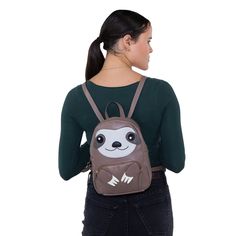 a woman wearing a brown backpack with a slot face on the front and back pocket