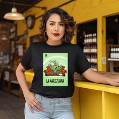 * Handmade item * Material: Printable Vinyl  * Made to order * Only ships to United States  from: Texas Los Marijuano's  Loteria T~Shirt If you love super soft, lightweight, extremely soft shirts then you will absolutely love our Gildan unisex for both men & women T- shirt ! They are hand pressed with a professional heat press for a soft, durable, printed graphic using high quality Printable Vinyl. This graphic unisex T-shirt , so while the fit is very nice and pretty true to size please check the Gildan chart for a more accurate estimate as I do not refunds for wrong size chosen nor exchanges. 🚨SHIPPING INFO  Please be advised that when it comes to shipping. Processing times and shipping times are two different elements.  🚨 Processing time shipping is 3-7 business days. That does not In Loteria Shirts, Mexican Gifts, Grand Prairie, Tshirt Funny, Printable Vinyl, T Shirt Funny, Heat Press, Party Gifts, Mary Janes