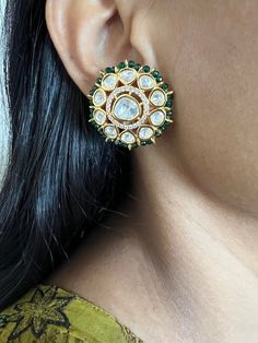 Restocked ♥️ On popular demand  This gorgeous Bridal Studs will add a perfect charm to your festive wear. One of our favorite picks for the wedding season  The diameter of the studs is 3cms. The weight of the studs is 12 grams per pair. Emerald Green beads border Notice the zirconia stones bordering the center Kundan piece. Premium Quality Festive Chandbalis With Gota Work For Reception, Festive Gota Work Chandbalis For Reception, Green Chandbalis With Gota Work For Wedding, Gota Work Bridal Earrings For Reception And Festivals, Wedding Bridal Earrings With Meenakari And American Diamond, American Diamond Bridal Earrings With Meenakari, Kundan Bridal Earrings With Zari Work For Reception, Bridal Earrings With Zari Work For Reception, Diwali Reception Chandbalis With Gota Work