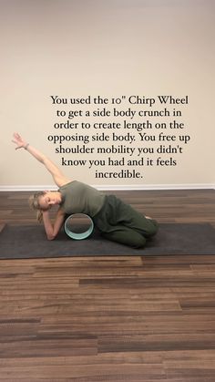 a woman is doing yoga on a mat in front of a wall with the words you used