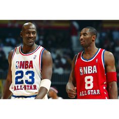 two basketball players standing next to each other