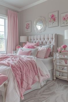 a bedroom decorated in pink and white