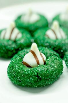 green cookies with white and brown candy on them