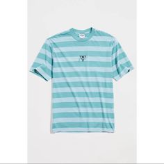 Striped Pattern T-Shirt By Guess Originals With A Logo Accent Embroidered At The Front. Crafted From 100% Cotton Cut In A Standard Fit With Short Sleeves & A Ribbed Knit Crew Neck. Content + Care - 100% Cotton - Machine Wash - Imported Sporty Light Blue Top For Summer, Light Blue Crew Neck Shirt For Summer, Light Blue Crew Neck Shirt For Spring, Light Blue Relaxed Fit Sporty Top, Blue Crew Neck Shirt For Spring, Sporty Light Blue Tops For Summer, Sporty Blue Summer Shirt, Light Blue Graphic Tee With Crew Neck, Light Blue Graphic Tee With Relaxed Fit