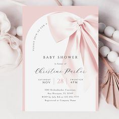 a baby shower is shown with pink and white accessories