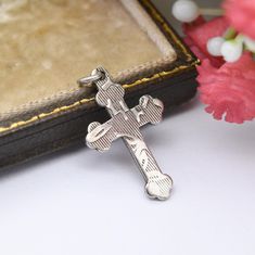 A beautiful vintage sterling silver cross pendant, with an interesting, understated design. Stamped for silver to the reverse. In nice vintage condition. Some of the detail to the design is worn. Please be sure to see all of the photos. Approximate Dimensions: Height - 2.1cm Width - 1.2cm Weight - 0.8 grams ----------------------- [[Please note, a chain is not included]] All boxes in the photos are for display purposes only, unless otherwise stated. Please be aware there will be marks and wear c Antique Cross Pendant Necklace As Gift, Vintage Cross Necklace As Gift, Vintage White Gold Cross Jewelry, Antique Silver Cross Necklace As Gift, Antique Pendant Cross Necklace As Gift, Antique Cross Pendant Necklace For Gift, Antique Silver Cross Necklace For Gift, Hallmarked White Gold Cross Necklace, Antique Silver Cross Necklace Gift