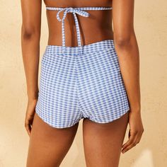 High-rise shortie swim bottom from Wild Fable™ with classic gingham print. Made from nylon-blend fabric with recycled polyester lining and metallic sparkle fibers for a touch of shine. Cheeky cut in thigh length flatters your figure. Four-way-stretch design provides flexible comfort in and out of the water. If you're not satisfied with any Target Owned Brand item, return it within one year with a receipt for an exchange or a refund. Wild Fable™: A look for every story. Gingham Beachwear Bottoms For Pool, Gingham Tie-side Swimwear For Beach, Gingham Tie-side Bottom Swimwear For Swimming, Fitted Gingham Tie-side Swimwear, Gingham Tie-side Swimwear, Wave Print, Gingham Print, Cheeky Bikinis, Swim Bottoms