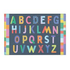 an alphabet rug with colorful letters and numbers on the front, in multi - colored squares