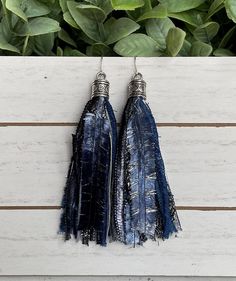 These vibrant tassel earrings will add the perfect pop of color to your wardrobe whether you're wearing a simple t-shirt and jeans or heading out in your favorite dress!  These fun earrings are made from carefully selected, high quality pieces of beautiful, rare novelty yarns.  The tassel part of the earring measures approximately 3 inches with a total drop length of 4 inches when including the earring end cap.  The end cap has a pretty antique heart pattern and the earring wire is stainless ste Denim Earrings, Boho Drop Earrings, Novelty Yarn, Shades Of Burgundy, Earring Wire, Boho Scarfs, Simple T Shirt, Ribbon Yarn, Long Tassel Earrings