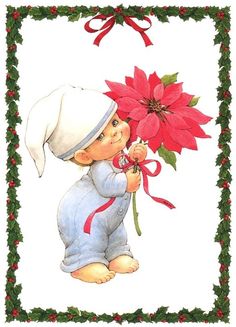 a little boy holding a red flower in front of a christmas frame with holly garland