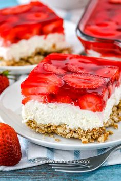 a piece of strawberry cheesecake on a plate with strawberries