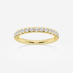 a yellow gold wedding band with white diamonds