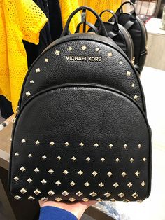 Michael Kors Women's Abbey Medium Studded Leather Backpack Black 35T8GAYB2L Pebbled leather with studded accent 100% polyester lining Gold tone hardware Zip closure Exterior features 1 zip pocket in front and 2 slide pockets on side Interior features 1 zip pocket, 1 large slip pocket and 2 multi-function slip pockets 23cm (W) x 30cm (H) x 11cm (D) Designer Leather Backpack With Branded Hardware, Designer Everyday Bags With Rivets, Designer Michael Kors Backpack, Designer Michael Kors Backpack With Adjustable Strap, Michael Kors Designer Backpack With Adjustable Strap, Designer Leather Bags With Rivets, Luxury Leather Bags With Rivets, Luxury Michael Kors Leather Backpack, Michael Kors Leather Backpack With Adjustable Strap