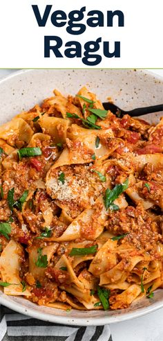 a white bowl filled with pasta and sauce