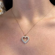 This Diamond Heart Pendant Features Round Brilliant Cut Diamonds Encrusted In Prong Setting In An Open Heart Design. Crafted In 14k Yellow Gold. Come With 18 Inches Rope Chain. Total Diamond Weight: 0.50 Carat. Diamond Color H-I And Vs-Si Clarity. Pendant Size: 17mm X 19mm. Total Weight: 3.69 Grams. Comes With A Presentable Gift Box. Id: 02842 Heart Pendant Diamond, Open Heart, Diamond Color, Diamond Heart, Heart Pendant Necklace, Round Brilliant Cut Diamond, Rope Chain, Round Cut Diamond, Heart Design