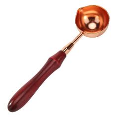 a metal spoon with a wooden handle on a white background