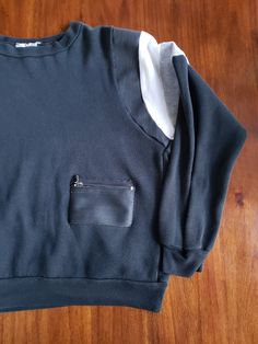 "SIZING: Extremely hard to size this sweatshirt as the tag was removed and the width is very wide but the length is a little short. Roomy width/bust room but shorter length and sleeve length, so if you are shorter in length, but need more chest/bust room, this may be a good fit. I will estimate that this sweatshirt is a Women's Small-Large and a Men's Small. Don't hold me to this sizes and decide for yourself. Here are the dimensions: Top to Bottom: About 22 & 1/4\" Pit to Pit: 23\" Mid-Back Sporty Crew Neck Tops With Pockets, Sporty Crew Neck Top With Side Pockets, Streetwear Crew Sweatshirt With Side Pockets, Crew Neck Sweatshirt With Side Pockets For Streetwear, Crew Neck Sweater With Pockets For Streetwear, Oversized Crew Neck Sweatshirt With Kangaroo Pocket, Sporty Crew Neck Sweater With Kangaroo Pocket, Oversized Crew Neck Top With Kangaroo Pocket, Relaxed Fit Crew Neck Sweater With Kangaroo Pocket