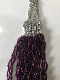 "Gorgeous multi-strand magenta and silver mini bead bib necklace on a multi-strand silver chain. Drape yourself in the wonderfully organic style of this magenta color glass bead bib necklace. The necklace is 23 1/2 inches in length and 2\" wide. Silver tone working spring ring closure. In very good vintage condition with one silver bead missing which not visible. I have taken this into consideration when pricing the item. Please see this section of my shop for more vintage costume jewelry: https Multi-strand Silver Beads Party Necklace, Party Multi-strand Beaded Necklace With Silver Beads, Party Multi-strand Silver Beaded Necklaces, Purple Beaded Chain Necklace For Party, Purple Beaded Necklaces For Party, Purple Beaded Necklace For Party, Silver Dangling Beads For Party, Silver Multi-strand Beaded Chain Beads, Purple Multi-strand Necklace For Party