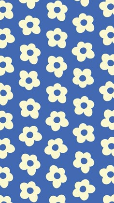 a blue and white flower pattern with circles in the middle, on a dark background