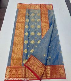 1.this is beautiful pure chanderi silk sari with running blouse piece 2.this sari is 5.5 mt length  4.fall n pico is complimentary  5.blouse can be made as per the requirements of the clients with proper measurements.stiching charges will be extra  6.plz check the availability of the sari before placing the order Chanderi Saree With Cutdana For Puja, Puja Chanderi Saree With Cutdana, Puja Saree In Chanderi With Cutdana Details, Cotton Silk Saree With Cutdana Detailing, Unstitched Cotton Silk Saree With Cutdana, Transitional Chanderi Saree In Traditional Drape, Chanderi Saree With Traditional Drape For Transitional Season, Festival Cotton Silk Dupatta With Zari Work, Blue Chanderi Saree With Sheer Dupatta