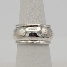 Vintage .925 Sterling Silver Band with Convex Center Statement Right Hand Ring This shining ring makes a great accent piece.  The sterling silver band has a convex center & a fitted top & bottom edge.  The ring is entirely sterling silver. It is in great vintage condition with a small amount of wear & scratches. Size: US 7, 10 mm wide Markings:  None Condition:  Great - small amount of wear & scratches All of my shop items are pre-owned vintage.  All pieces should be expected to have some vintage wear unless otherwise stated.   Great for the vintage & costume jewelry lover!  Be sure to check out our other vintage jewelry listings! Looking for something that isn't listed in my shop? Send me a message! I have thousands of pieces in stock. Adjustable White Gold Wide Band Ring For Anniversary, Silver Stackable Rings With Thick Band For Formal Occasions, Silver Wide Band Ring With Polished Finish For Anniversary, Silver Wide Band Ring For Anniversary, Classic Silver Wide Band Ring Hallmarked, Classic Silver Band Ring, Classic Silver Rings With Decorative Band, Classic Silver Jewelry With Decorative Band, Silver Classic Jewelry With Decorative Band