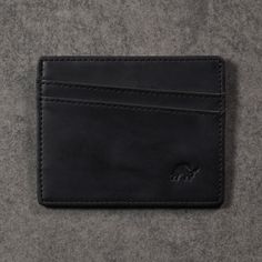 This one’s self explanatory; it’s a premium leather hammock for your cards. Bullstrap wallets are created with your journey in mind. Optimized for endurance and accelerated usability to propel you forward. Embossed with our signature emblem and embedded with RFID shielding technology. Four Card Slots One Slip Center Cash Pocket RFID Blocking (tested at 132Mhz) L: 4 inches. H: 3.5 inches W: 0.25 inches Functional Leather Card Holder With Rfid Blocking, Functional Leather Card Holder For Daily Use, Black Card Holder For Everyday Use, Black Leather Card Holder With Id Window, Functional Black Card Holder With Interior Slots, Black Functional Everyday Card Holder, Black Rfid Blocking Card Holder For Everyday Use, Functional Black Card Holder, Functional Black Card Holder For Everyday Use