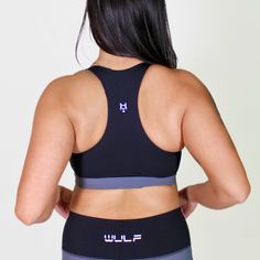 MATERIAL: 63% nylon/37%spandex FIT: ﻿True to size. DESIGN: Sports bra with scoop neckline. Medium support bra. Added zipper in the middle of the chest. Available in purple/black and gray/black. MODEL: Model is 5'5", 120 lbs, wearing a size Medium. WASHING: We recommend washing inside-out on a cold setting. Hang to dry. This sensational sports bra is designed to elevate your workout and give you confidence in the gym. Crafted with a chic scoop neckline, this medium support gym bra embraces your c Black Sporty Crop Top With Scoop Neck, Black Sporty Scoop Neck Crop Top, Sporty Black Scoop Neck Crop Top, Sporty Gray Crop Top For Sports, Sporty Fitted Scoop Neck Bra, Racerback Training Bra With Medium Bust Support, Training Bra With Medium Bust Support, Racerback, Black Sports Crop Top With Medium Bust Support, Gray Sporty Crop Top For Gym