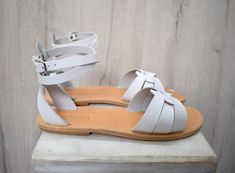 White Handmade Leather Sandals, Handmade White Leather Sandals, Handmade Summer Sandals, Handmade Open Heel Sandals For Summer, Handmade White Sandals For Spring, White Leather Toe Ring Sandals For Beach, Adjustable White Sandals For Festivals, Handmade White Ankle Strap Sandals, White Open Toe Huarache Sandals For Vacation