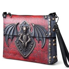 Unique printed versatile shoulder/hand digital art black and red gothic antique style skull bag, a modern bag with a unique artistic design. This faux leather rectangular bag has a print of an antique-style red and black gothic skull style, printed on both sides. It is light and comfortable, great for everyday use. Please consider that the bag features a 2D PRINTED design artwork that is meant to give the IMPRESSION of a 3D design. The bag has no real leather or metal. The zipper is on the top of the bag.   Keep your style on point and your hands-free with this versatile crossbody bag. It's made of premium faux leather and features dark gray hardware. You can keep your essentials secure and organized thanks to the zip-top closure and multiple inside pockets. Transform this crossbody bag wi Gothic Large Capacity Shoulder Bag, Punk Style Rectangular Shoulder Bag, Gothic Crossbody Shoulder Bag With Zipper, Gothic Crossbody Shoulder Bag With Zipper Closure, Gothic Crossbody Travel Bag, Gothic Large Capacity Bag For Everyday Use, Gothic Crossbody Shoulder Bag For Travel, Punk Style Rectangular Bag With Zipper Closure, Gothic Satchel Shoulder Bag For Travel