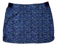 a blue and white patterned skirt with small dots on the bottom, in front of a white background