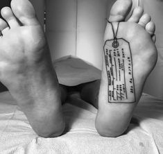 a person has a tattoo on their foot