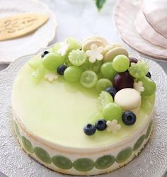 there is a cake with grapes on it